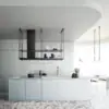 Falmec hood Europa Evo Island 175 Black above a marble island in a contemporary kitchen with terrazzo floor