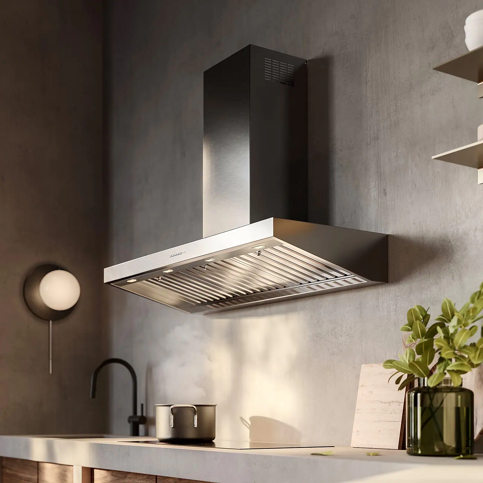 Falmec Marte Pro 90 Inox wall hood in minimalist kitchen with walnut cabinets and concrete worktop