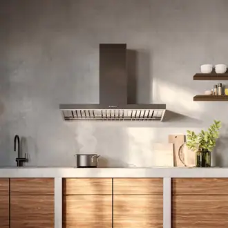 Falmec hood Marte Pro 90 Inox mounted in concrete-finish kitchen with steam rising over cooktop