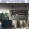 Falmec hood Spazio 180 Black suspended above a kitchen island with fluted base and garden view behind