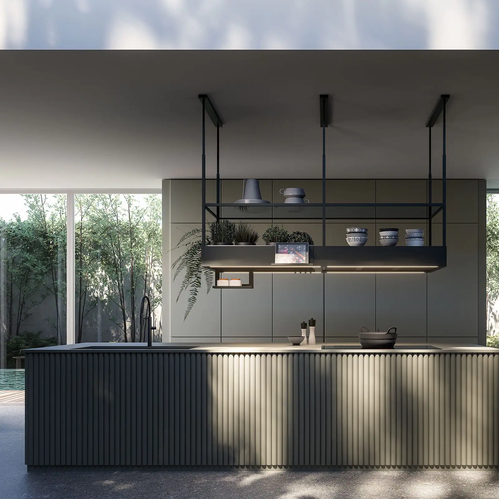 Falmec hood Spazio 180 Black suspended above a kitchen island with fluted base and garden view behind