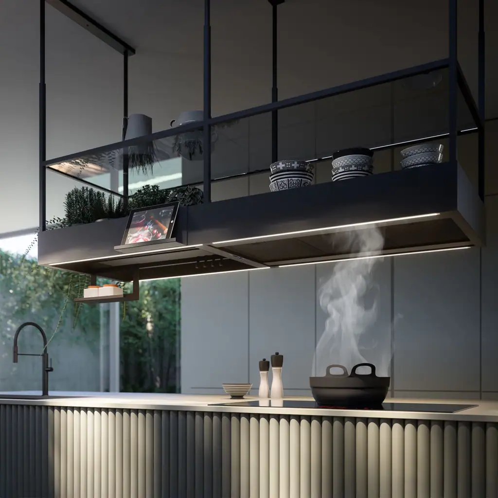 Falmec Spazio island hood drawing steam from a pan on the cooktop