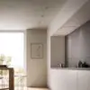 Falmec hood Stella Plus 120 Inox installed flush in a minimalist kitchen ceiling beside a desert-view window