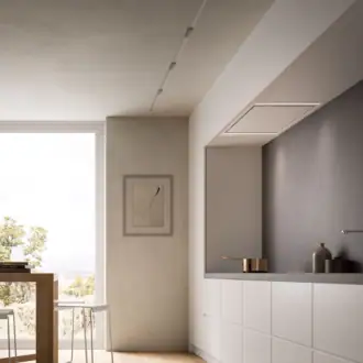 Falmec hood Stella Plus 120 Inox installed flush in a minimalist kitchen ceiling beside a desert-view window