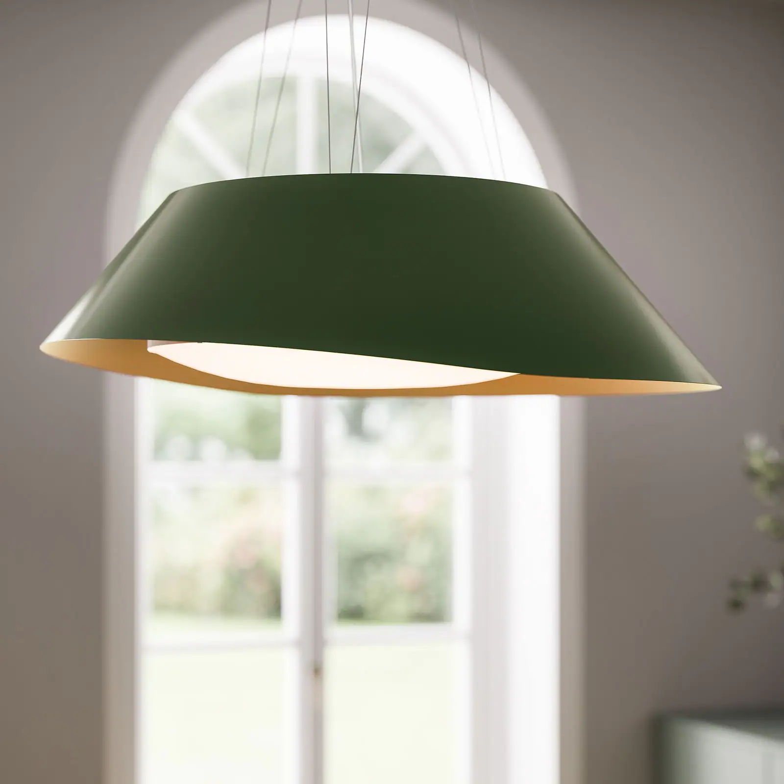 Falmec Vogue 88 green island hood in a kitchen with arched moulding