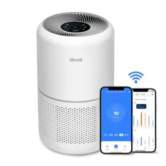 Levoit air purifier Core 300S white tower with VeSync app on phone