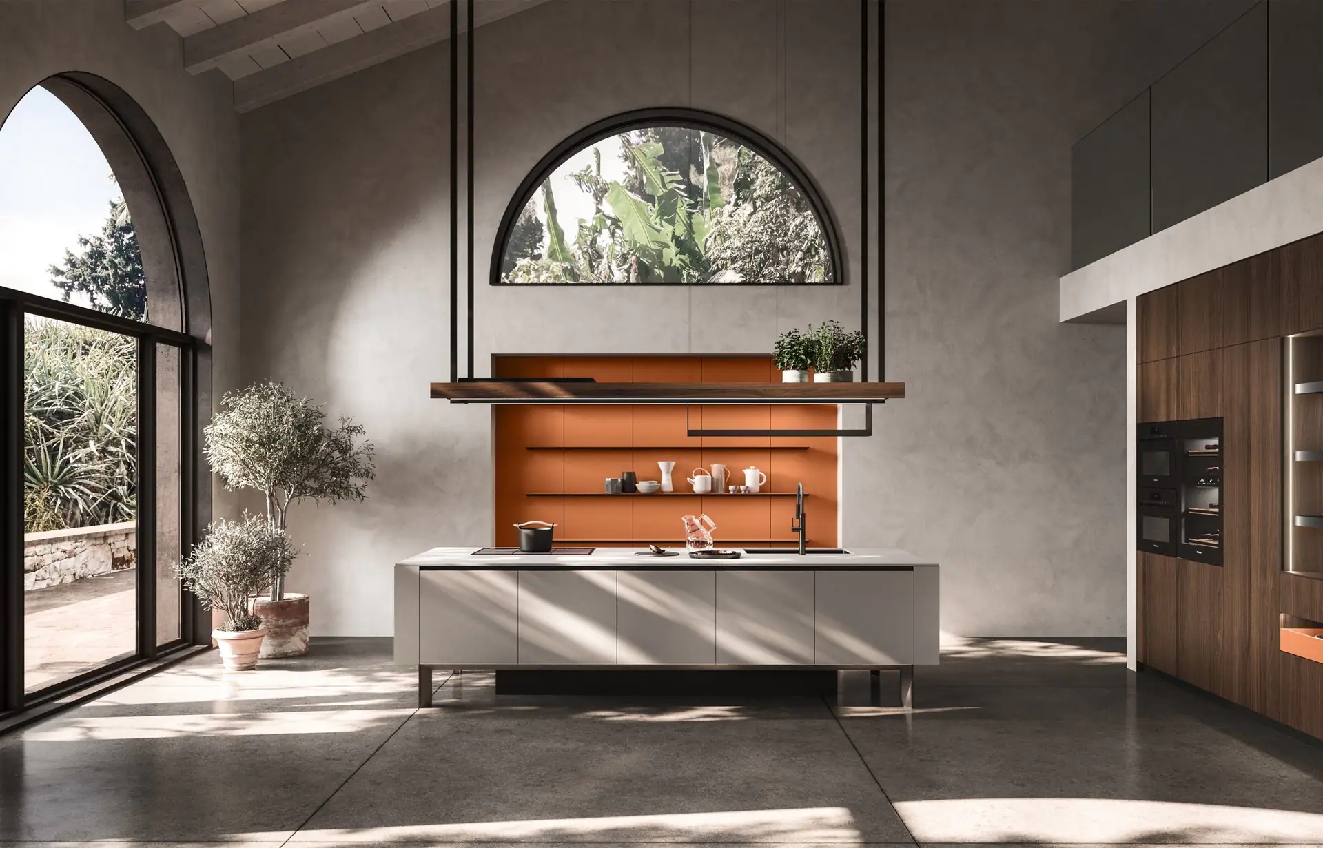 Arrital kitchen island with orange back wall under an arched window