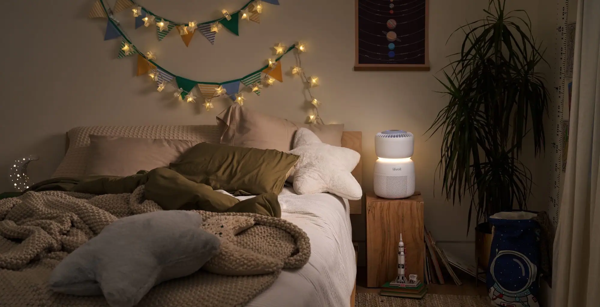 Levoit Sprout air purifier in a bedroom