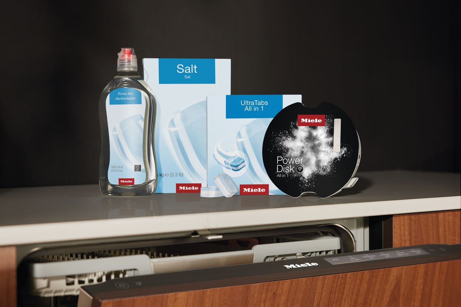 Miele dishwasher detergents on a kitchen counter