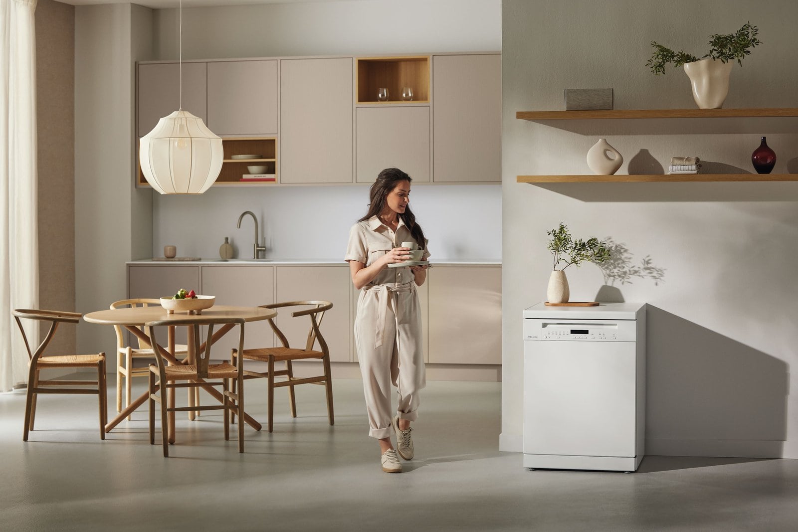 Miele freestanding dishwasher in a bright modern kitchen