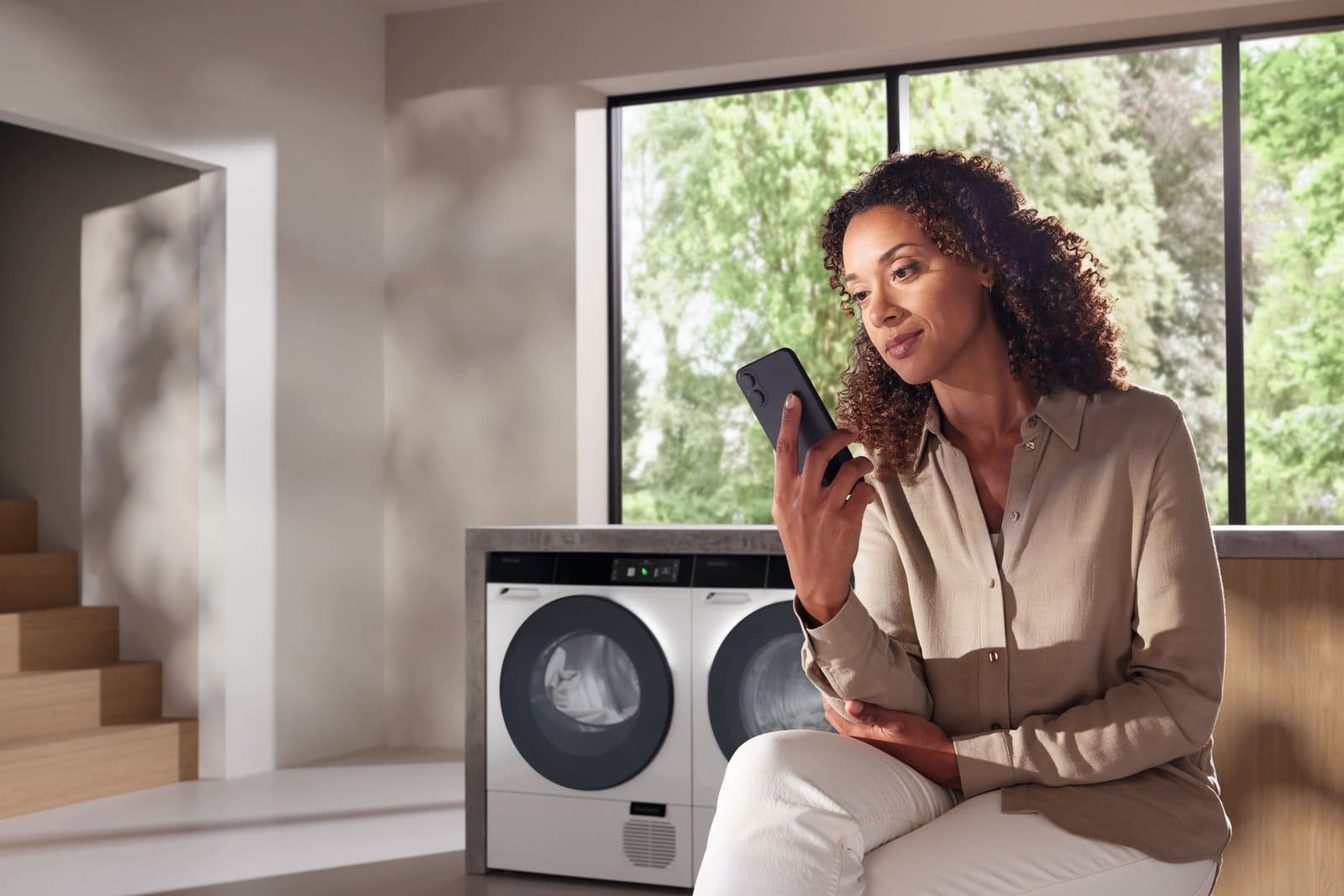 Planning a laundry room with the help of a phone