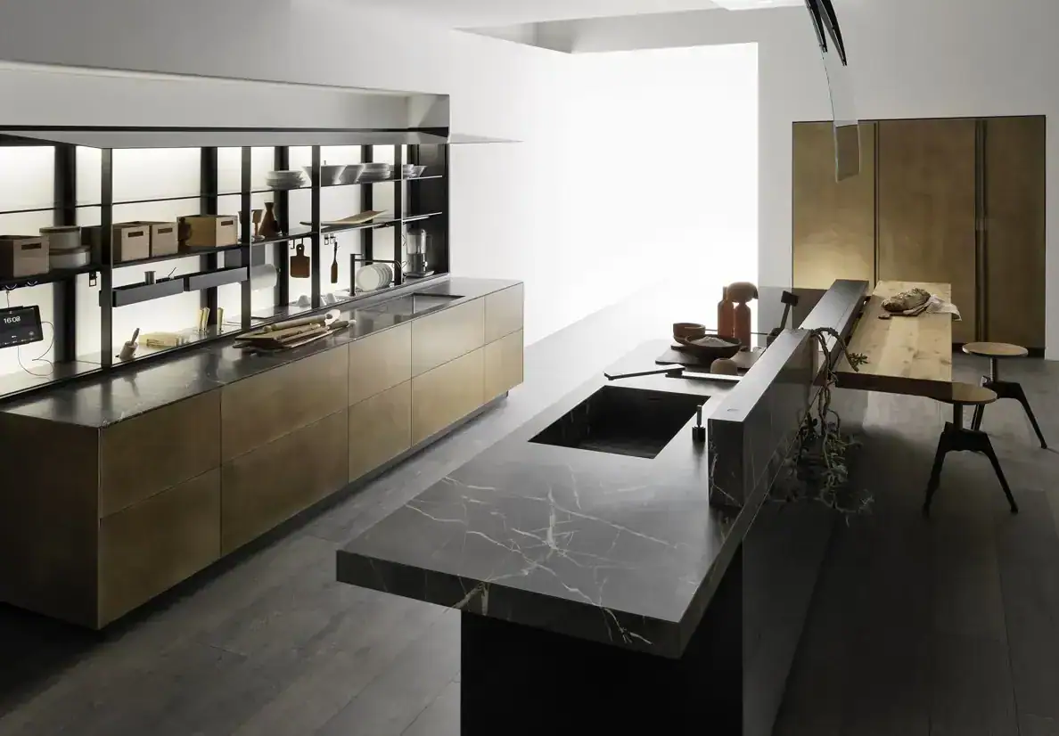 Valcucine kitchen with a dark stone island and open metal shelving