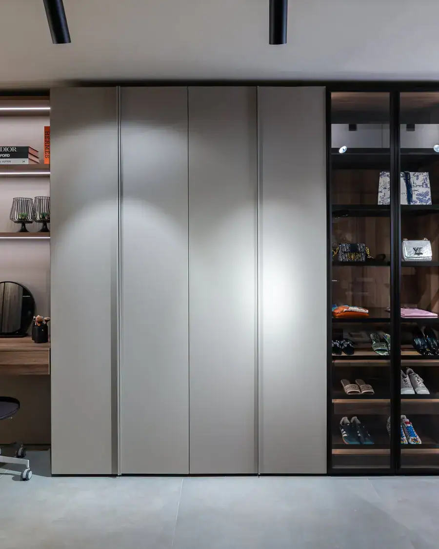 Floor-to-ceiling wardrobe with a lit glass section